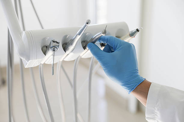 Professional Tooth Extraction technician working in Four Oaks, NC